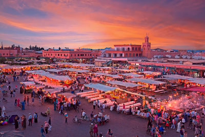 Evening on djemaa el fna square with koutoubia mosque, marrakech, morocco