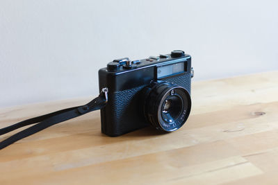 Close-up of camera on table