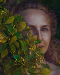 Portrait of young woman with leaves