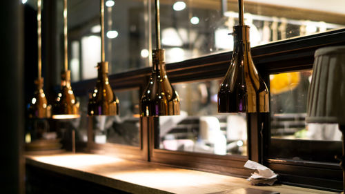 Glass of bottles on table in restaurant