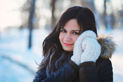 Portrait of smiling young woman in winter