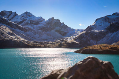 Scenic view of snowcapped mountains against sky