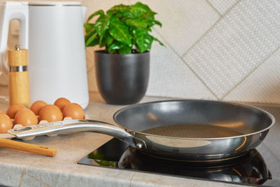 Induction hob with frying pan, kitchen appliance