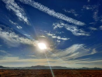 Low angle view of sun shining on sunny day