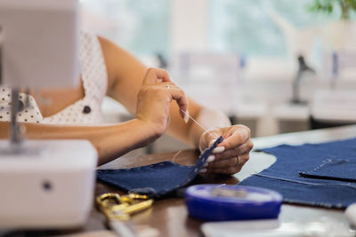 Midsection of woman working on table