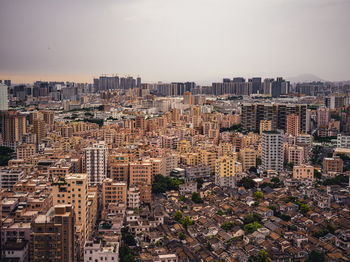 High angle view of buildings in city against sky