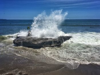 Waves breaking on shore
