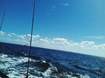 Scenic view of sea against blue sky