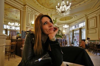 Portrait of woman sitting in corridor