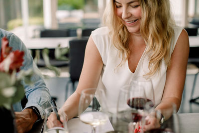 Woman sitting at restaurant table