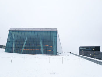 Modern building against clear sky during winter