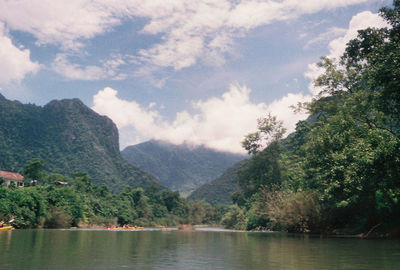 Scenic view of lake against cloudy sky