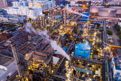 High angle view of illuminated factory at night