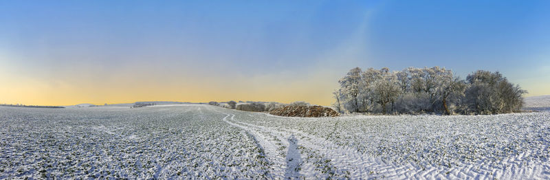 Panoramic winter landscape with sunrise near bad frankenhausen, thuringia, germany