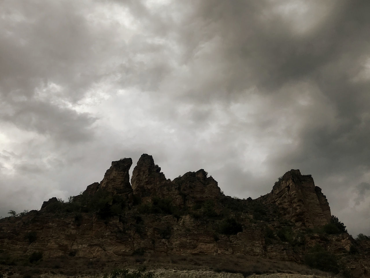 LOW ANGLE VIEW OF ROCKS AGAINST SKY