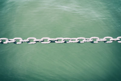 High angle view of chain above sea