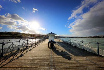 Pier over sea against sky