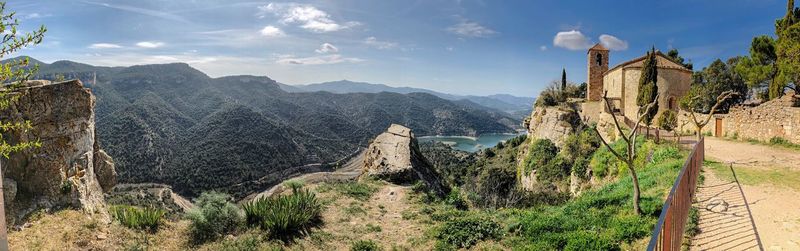 Panoramic view of castle on mountain against sky