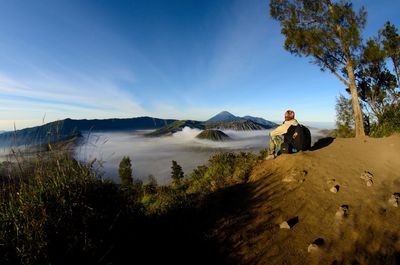 Man on mountain against sky