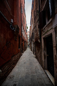 Narrow alley amidst buildings in town