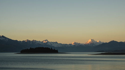 Scenic view of silhouette mountains against sky during sunset
