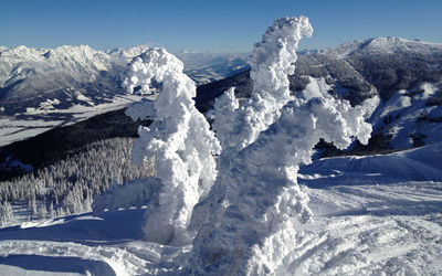 Scenic view of snowcapped mountains against sky / in schladming austria 