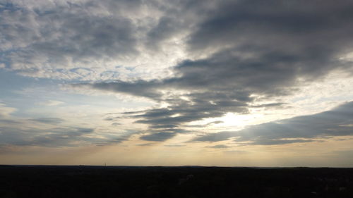 Low angle view of silhouette land against sky during sunset