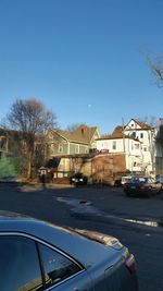 Cars on road against clear sky