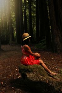 Side view of woman in forest