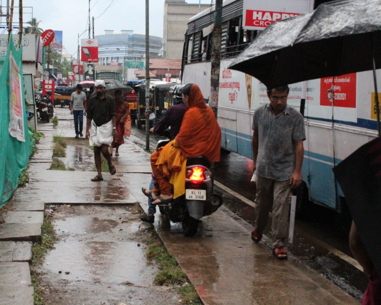 REAR VIEW OF PEOPLE WORKING ON CITY