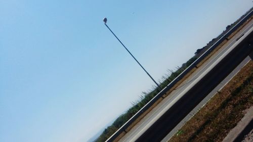 Railroad tracks against clear sky