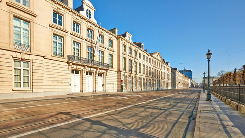 Street amidst buildings against sky