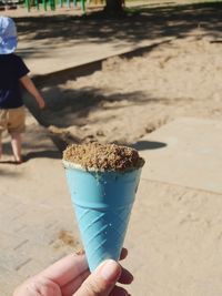 Hand holding ice cream