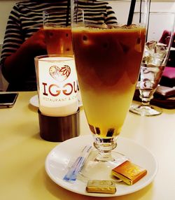 Close-up of beer glass on table