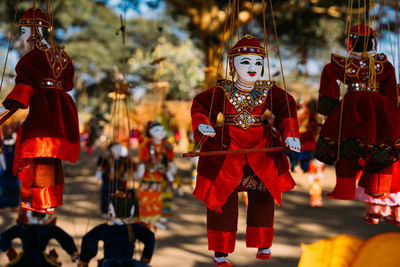 Close-up of puppets for sale