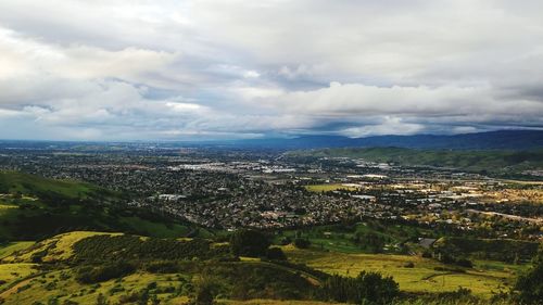 Scenic view of landscape against cloudy sky