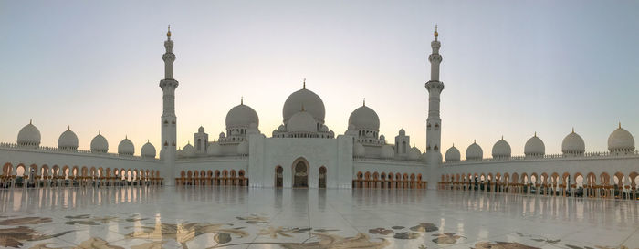 View of mosque against clear sky in city