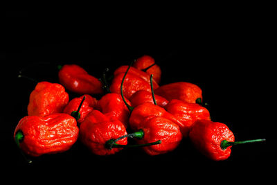 Close-up of cherries against black background