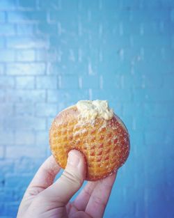 Cropped image of hand holding ice cream