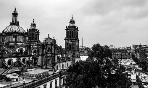 View of buildings in city against sky