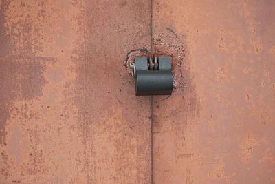 Close-up of padlock on wall