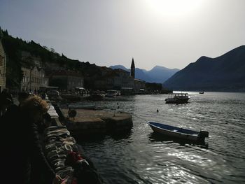 Boats sailing in sea against sky