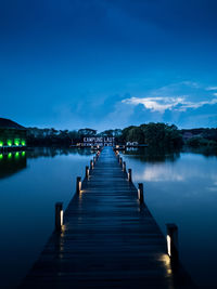 Pier over lake against sky