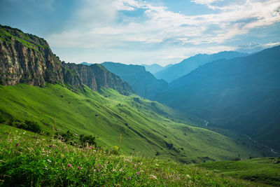 Gorge with a river in the mountains in summer. scenic view of mountains against sky