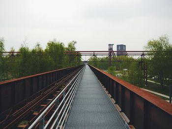 Railroad tracks against sky