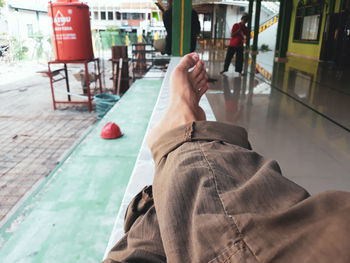 Low section of woman relaxing on seat