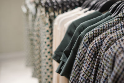 Close-up of clothes hanging in store