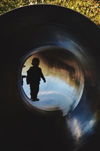 Silhouette boy in water