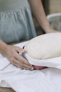 Midsection of woman preparing food