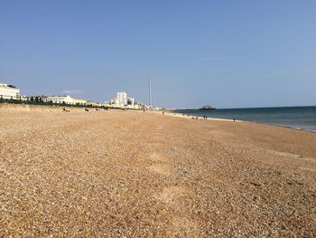 Scenic view of beach against clear sky